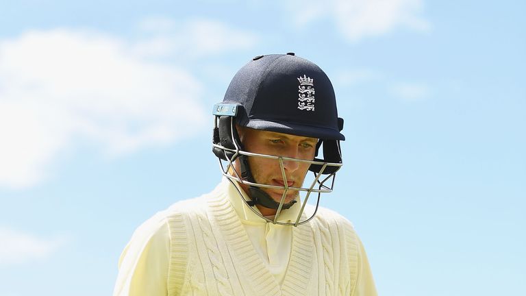 Joe Root of England bats walks off the field after being dismissed by Nathan Lyon of Australia