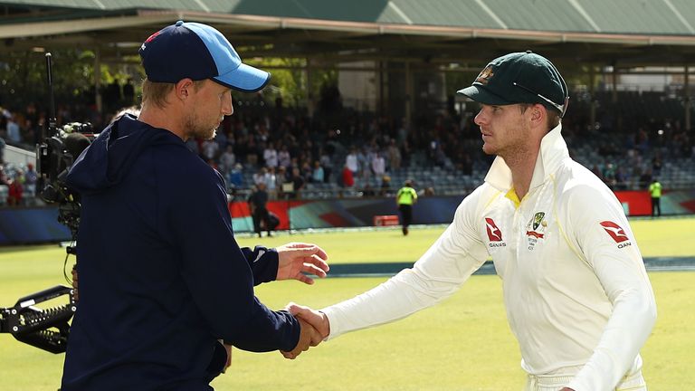 Joe Root of England and Steve Smith of Australia shake hands after Australia claimed victory