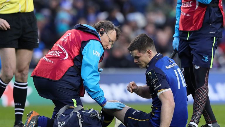 Leinster's Johnny Sexton receives attention after he was injured in the early stages of the match