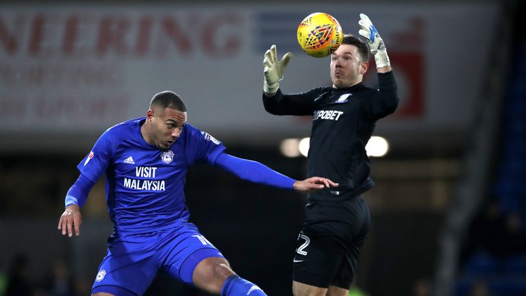 Cardiff City's Kenneth Zohore (left) and Preston North End goalkeeper Chris Maxwell battle for the ball