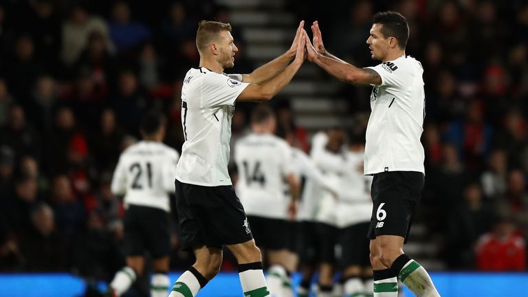 BOURNEMOUTH, ENGLAND - DECEMBER 17:  Ragnar Klavan of Liverpool and teammate Dejan Lovren of Liverpool celebrate their teams first goal during the Premier 