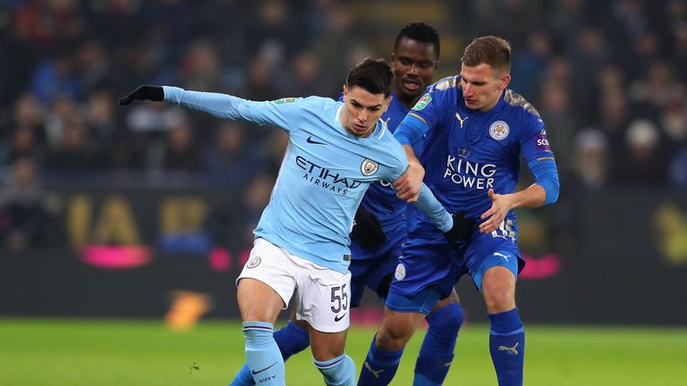 LEICESTER, ENGLAND - DECEMBER 19:  Brahim Diaz of Manchester City holds off Daniel Amartey and Marc Albrighton of Leicester City during the Carabao Cup Qua