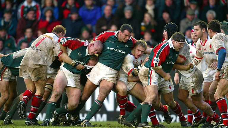 Martin Johnson of Leicester and his team mates drive forward during the Heineken Cup