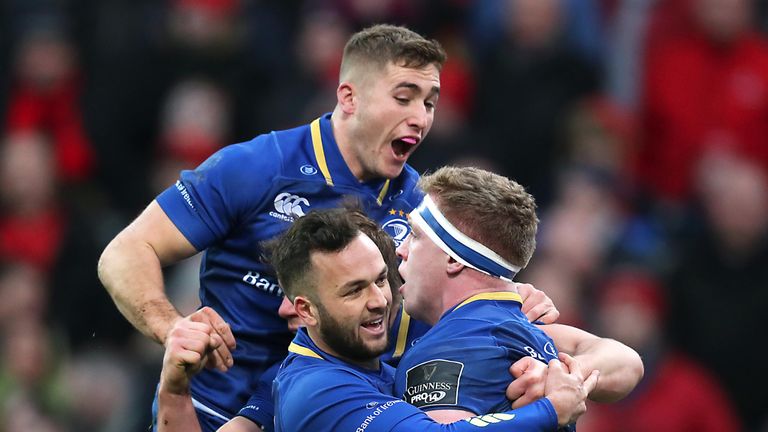 an Leavy celebrates scoring their first try with Jordan Larmour and Jamison Gibson-Park