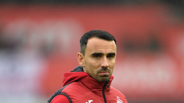 SWANSEA, WALES - DECEMBER 23:  Leon Britton, Caretaker manager Player/Manager of Swansea City looks on as his team warm up prior to the Premier League matc