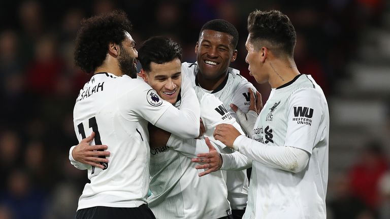 Liverpool's Philippe Coutinho (left centre) celebrates with his team-mates after scoring his side's first goal during the Premier League match at the Vital