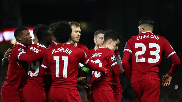 LIVERPOOL, ENGLAND - DECEMBER 06: Philippe Coutinho of Liverpool celebrates after scoring his sides first goal with his Liverpool team mates during the UEF