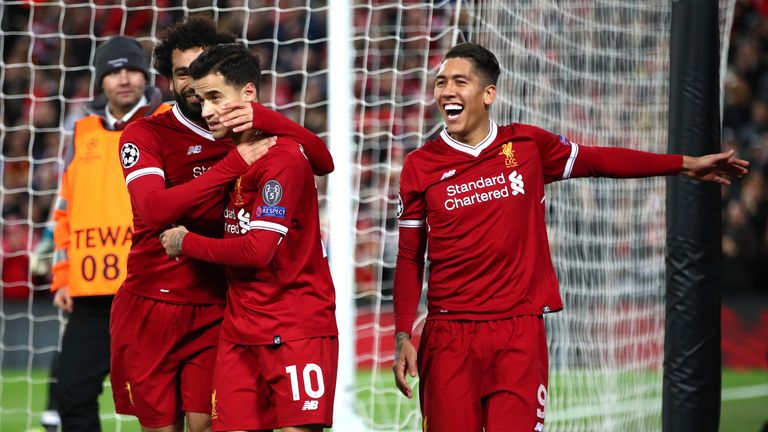 LIVERPOOL, ENGLAND - DECEMBER 06:  Philippe Coutinho of Liverpool celebrates after scoring his sides fifth goal with Mohamed Salah of Liverpool and Roberto