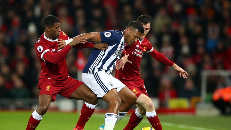LIVERPOOL, ENGLAND - DECEMBER 13:  Jose Salomon Rondon of West Bromwich Albion is challenged by Georginio Wijnaldum of Liverpool and Andy Robertson of Live
