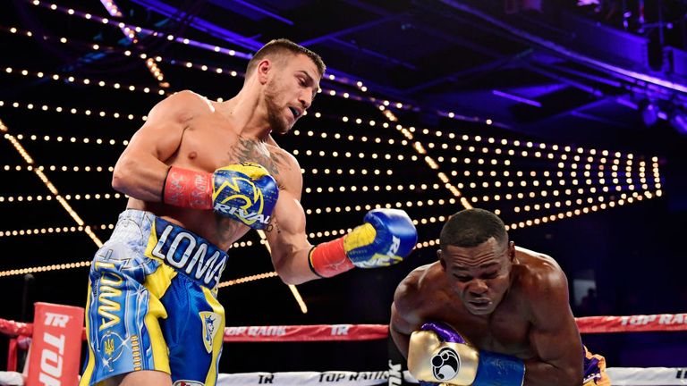  Vasiliy Lomachenko (L) punches Guillermo Rigondeaux during their Junior Lightweight bout at Madison Square Garden
