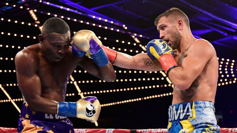 Vasiliy Lomachenko (R) punches Guillermo Rigondeaux during their Junior Lightweight bout at Madison Square Garden 