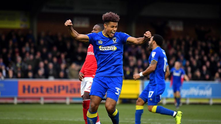 Lyle Taylor of AFC Wimbledon celebrates after scoring against Charlton in the FA Cup