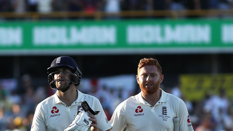 PERTH, AUSTRALIA - DECEMBER 14:  Dawid Malan and Jonny Bairstow of England leave the ground at stumps on 110 not out during day one of the Third Test match