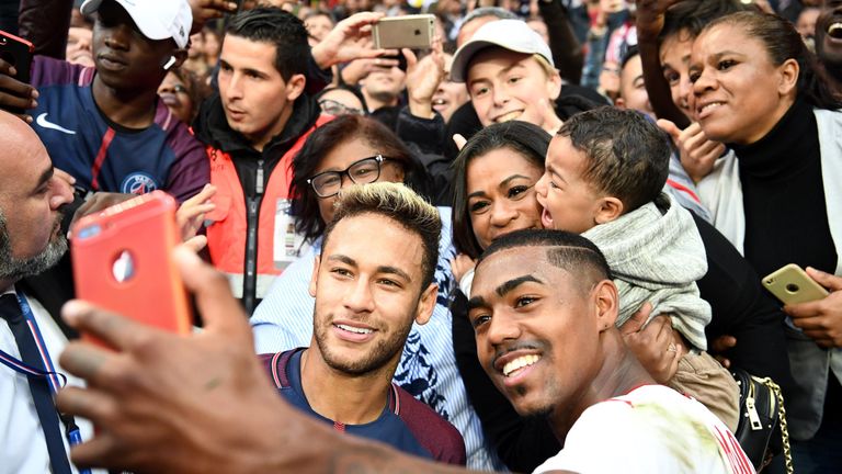 Paris Saint-Germain's Brazilian forward Neymar (L) and Bordeaux's Brazilian forward Malcom take a selfie at the end of the French L1 football match between