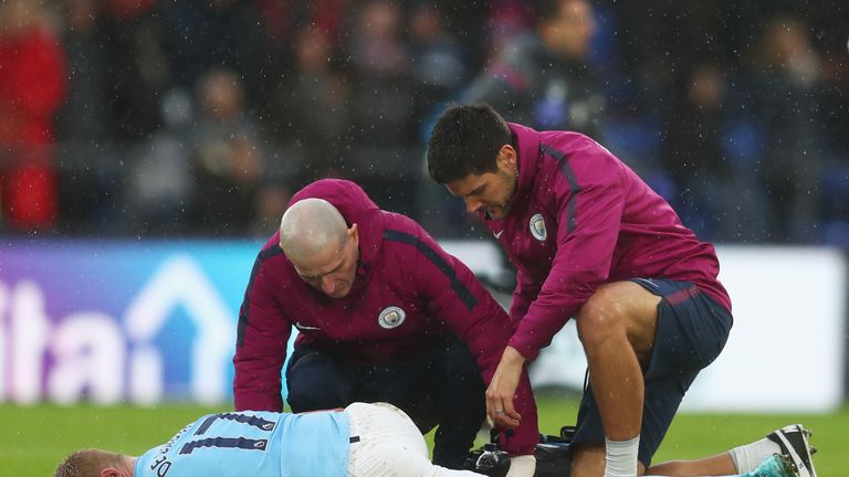 Kevin De Bruyne is tended to by Manchester City's medcial staff