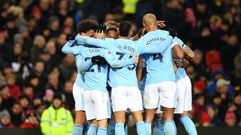 David Silva of Manchester City celebrates scoring the first Manchester City goal with team mates during the Premier League match at Manchester United