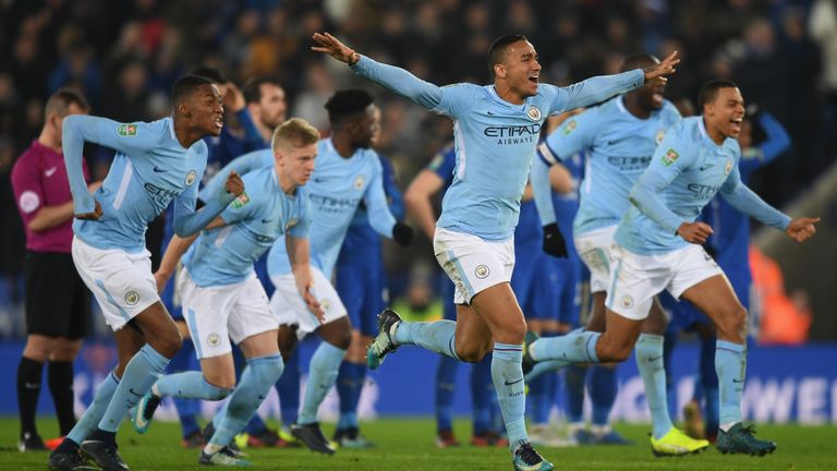 Manchester City players celebrate their penalty shootout win at Leicester