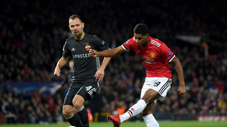 MANCHESTER, ENGLAND - DECEMBER 05:  Marcus Rashford of Manchester United shoots during the UEFA Champions League group A match between Manchester United an