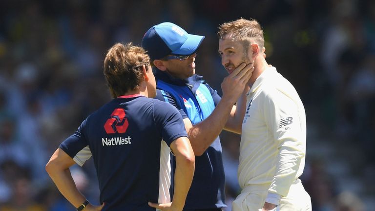 PERTH, AUSTRALIA - DECEMBER 14:  Mark Stoneman of England is checked by medical staff after being hit in the helmet during day one of the Third Test match 