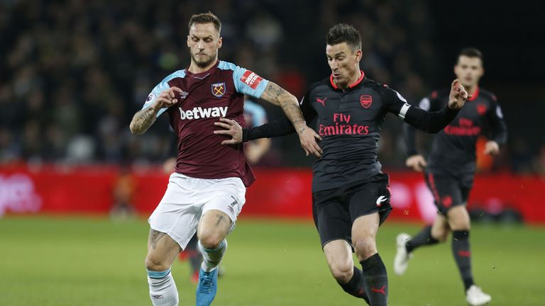 Marko Arnautovic and Laurent Koscielny in action at the London Stadium