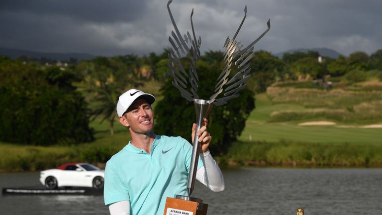 BEL OMBRE, MAURITIUS - DECEMBER 03:  Dylan Frittelli of South Africa lifts the trophy as he celebrates AfrAsia Bank Mauritius Open at Heritage Golf Club.