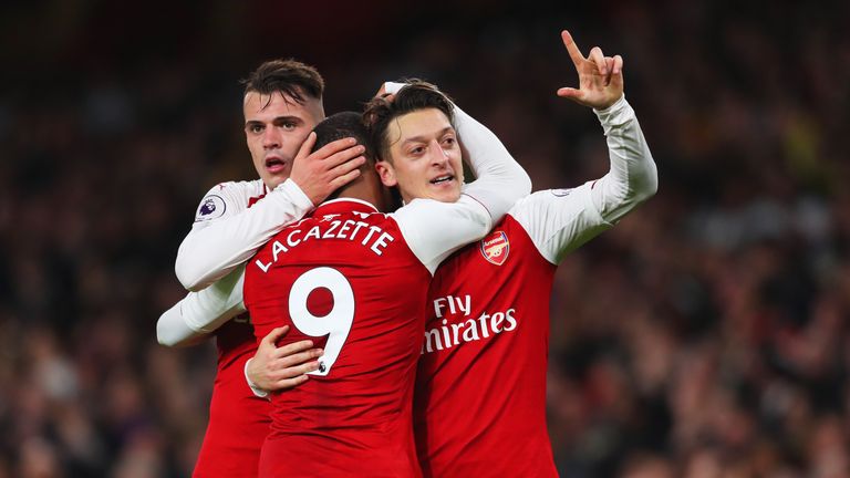 Mesut Ozil celebrates Arsenal's third goal with Granit Xhaka and Alexandre Lacazette