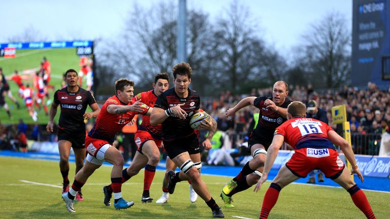 Michael Rhodes of Saracens runs at the Worcester defence