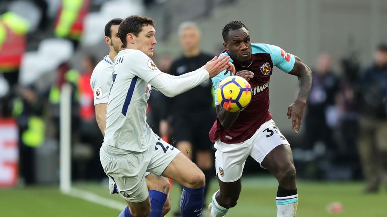 Michail Antonio chases a loose ball under pressure from Andreas Christensen