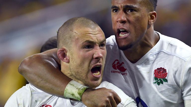 England player Mike Brown (L) is congratulated by teammate Anthony Watson (R) after scoring against Australia during the third rugby union Test match in Sy