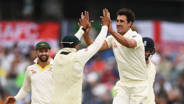 Mitchell Starc of Australia is congratulated by team mates after getting the wicket of James Vince of England