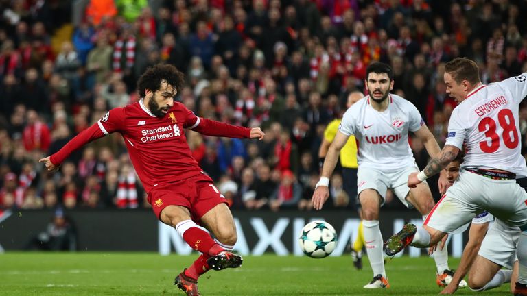 LIVERPOOL, ENGLAND - DECEMBER 06: Mohamed Salah of Liverpool scores his sides seventh goal during the UEFA Champions League group E match between Liverpool