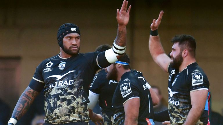 Montpellier's French hooker Romain Ruffenach (R) and Montpellier's Fijian winger Nemani Nadolo (L) celebrate after scoring a try against Glasgow