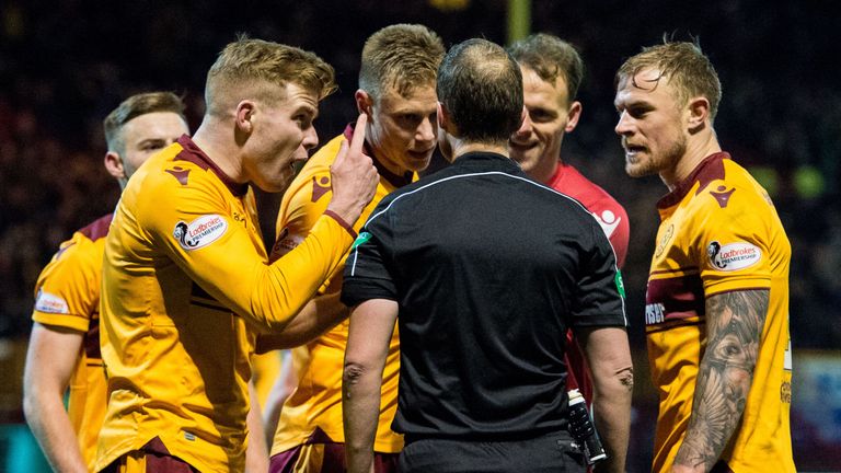 Motherwell's players make their feelings known to referee Willie Collum