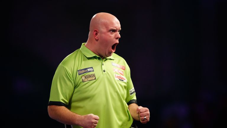 Michael van Gerwen celebrates during his match against Gerwyn Price on day eleven of the William Hill World Darts Championship