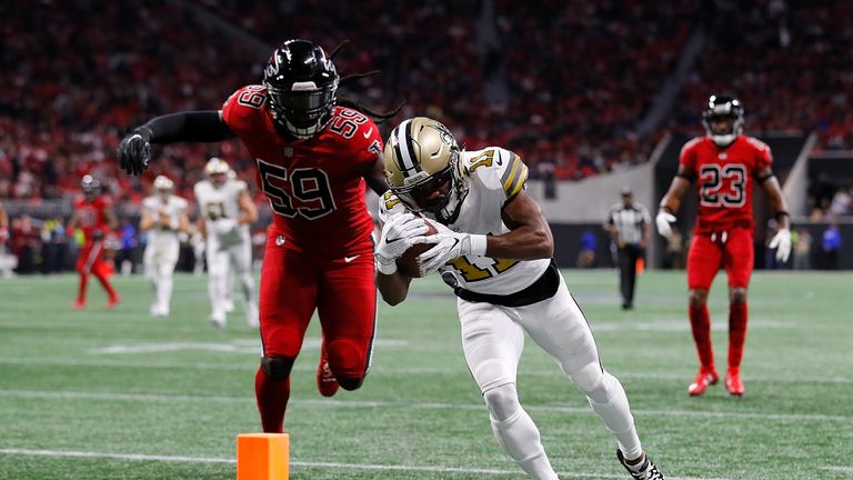 ATLANTA, GA - DECEMBER 07:  Tommylee Lewis #11 of the New Orleans Saints prepares to dive for a touchdown before being tackled by De'Vondre Campbell #59 of