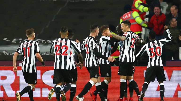 Mohamed Diame celebrates with his team-mates after putting Newcastle ahead