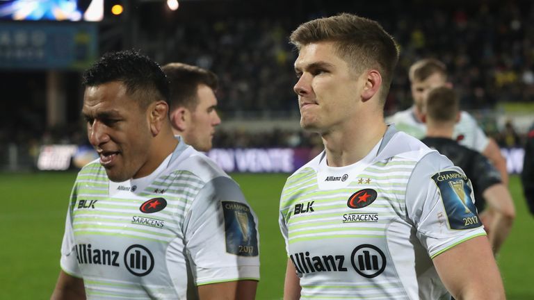 CLERMONT-FERRAND, FRANCE - DECEMBER 17:  Owen Farrell, (R) the Saracens captain, walks off the field with team mate Mako Vunipola after a his sides narrow 