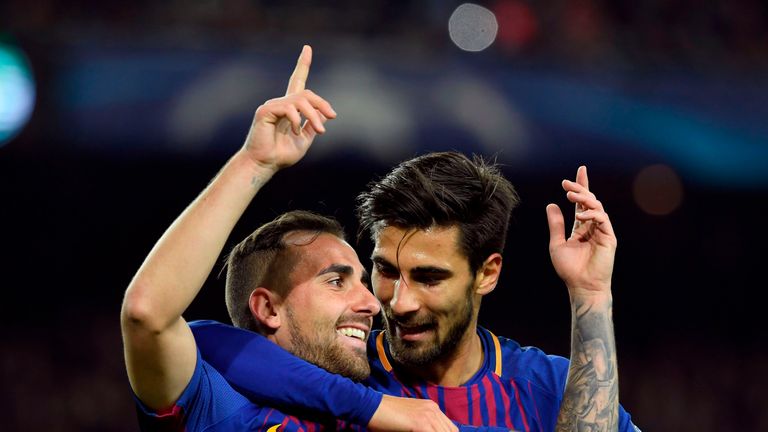 Barcelona's Spanish forward Paco Alcacer (L) celebrates with Barcelona's Portuguese midfielder Andre Gomes after scoring a goal during the UEFA Champions L