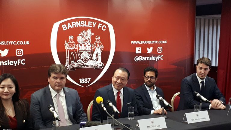 Barnsley owners Grace Hung (left). Paul Conway (second left) and Chien Lee (centre) during a press conference at Oakwell Stadium, Barnsley.