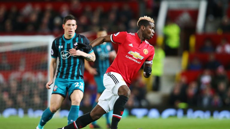 Paul Pogba of Manchester United runs with the ball during the Premier League match between Manchester United and Southampton