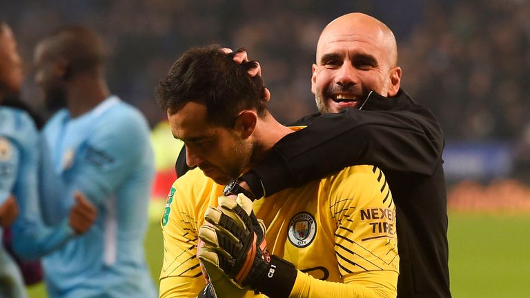 Pep Guardiola celebrates with goalkeeper Claudio Bravo defeating Leicester City 4-3 on penalties in the Carabao Cup Quarter-Final