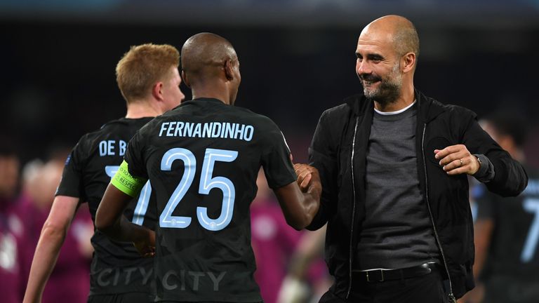 NAPLES, ITALY - NOVEMBER 01:  Fernandinho of Manchester City and Josep Guardiola, Manager of Manchester City embrace after the UEFA Champions League group 