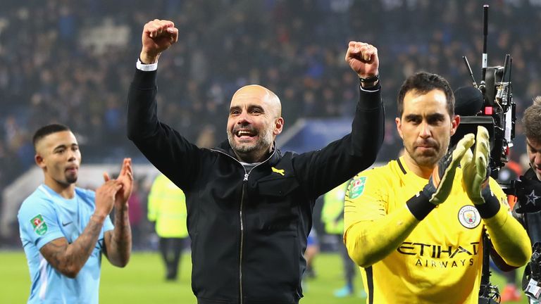LEICESTER, ENGLAND - DECEMBER 19:  Claudio Bravo of Manchester City and Josep Guardiola, Manager of Manchester City celebrate penalty shoot out victory aft