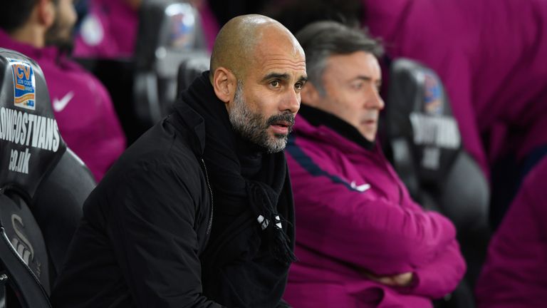 Pep Guardiola looks on from the touchline at the Liberty Stadium