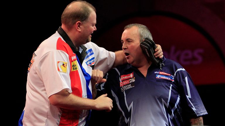 PHIL TAYLOR V RAYMOND VAN BARNEVELD .TROUBLE FLARES BETWEEN PHIL TAYLOR AND RAYMOND VAN BARNEVELD AT THE END OF THE MATCH
