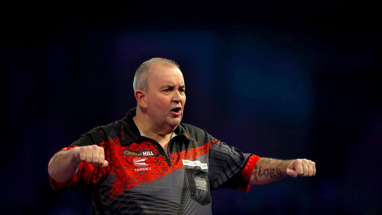 Phil Taylor reacts during his semi-final victory over Jamie Lewis in the World Championship