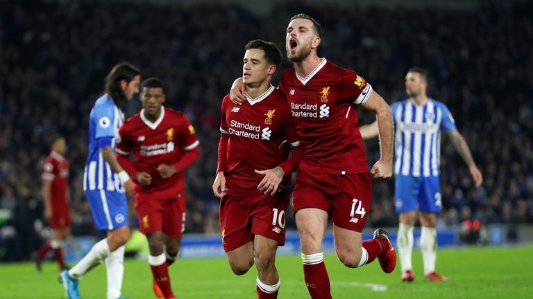 BRIGHTON, ENGLAND - DECEMBER 02:  Philippe Coutinho of Liverpool celebrates with team-mates including Jordan Henderson after scoring his team's fourth goal