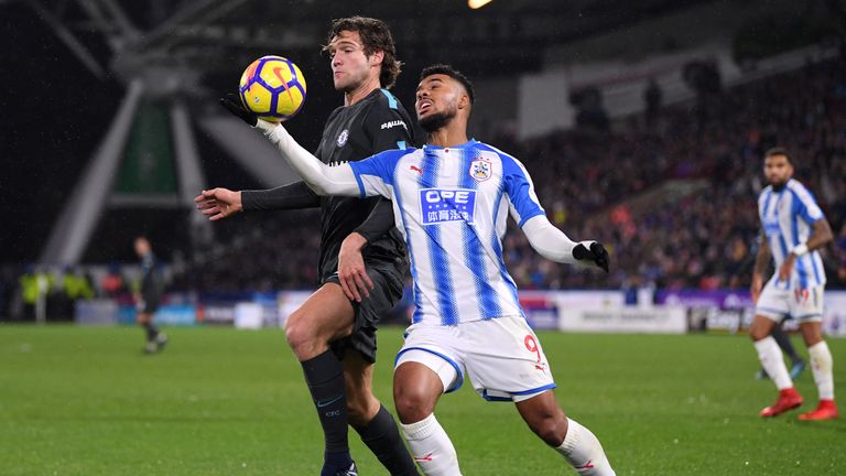 Elias Kachunga handles the ball under pressure from Marcos Alonso