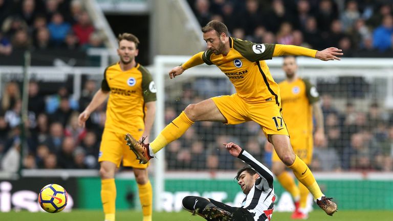 Glenn Murray evades the challenge of Mikel Merino