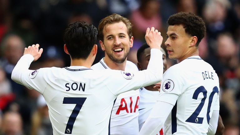 Harry Kane celebrates with Heung-Min Son and Dele Alli after scoring his second goal